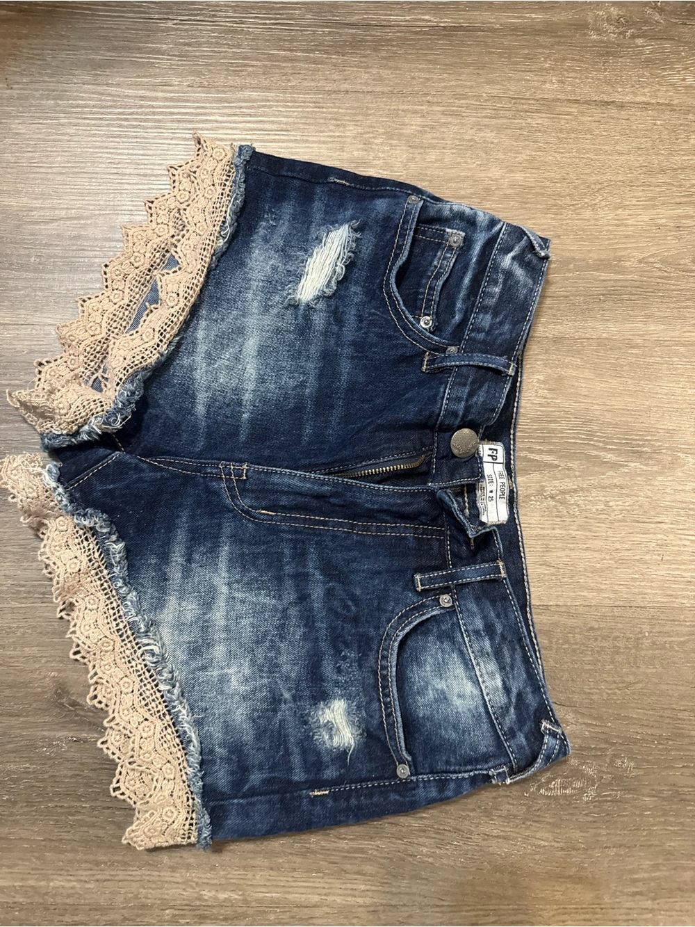 Free People Dark Blue Distressed Denim Shorts with Cream Lace Trim